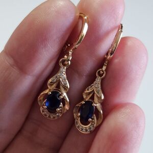 Gold Tone Dangling Blue Rhinestone Earrings With Clear Rhinestone Accents
